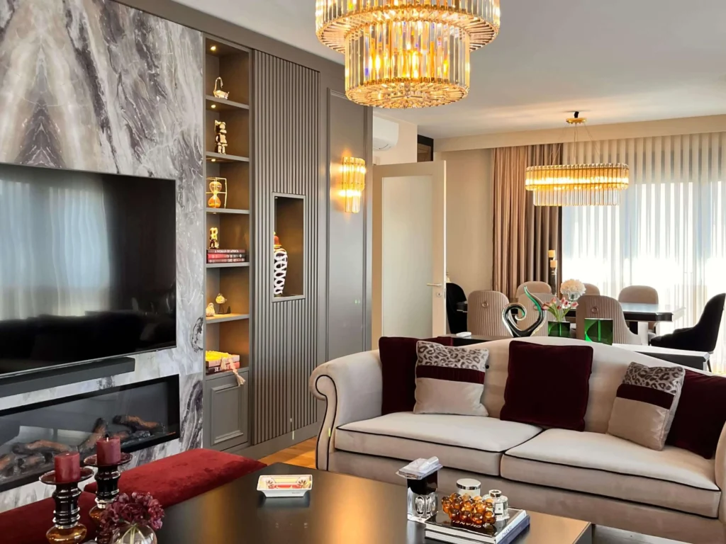 Luxury living room with a custom marble wall panel behind the television.